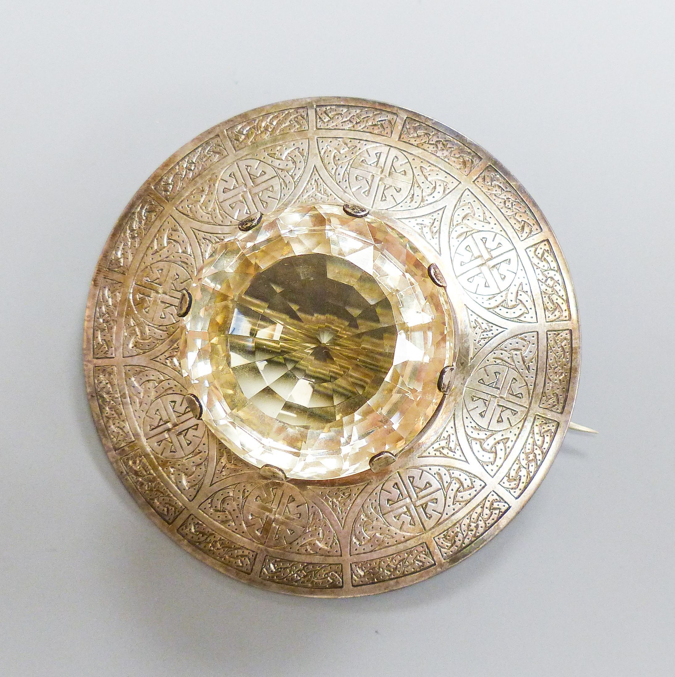 A late Victorian Scottish silver and large cairngorm set circular brooch, Robert & Henry Bruce Kirkwood, Edinburgh, 1892, diameter 81mm, gross weight 134.4 grams.